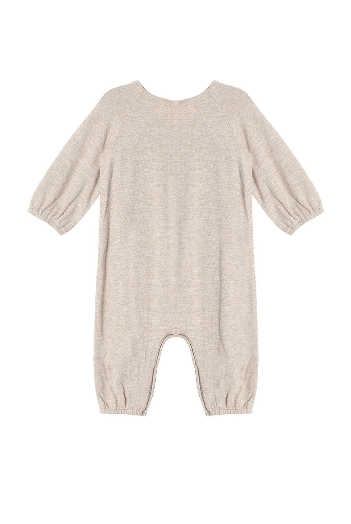 The Millie Romper by Mabel and Honey is a beige long-sleeve piece with an empire waist, elastic cuffs at the sleeves and ankles, smock detailing, and soft textured fabric, shown laid flat on a white background.