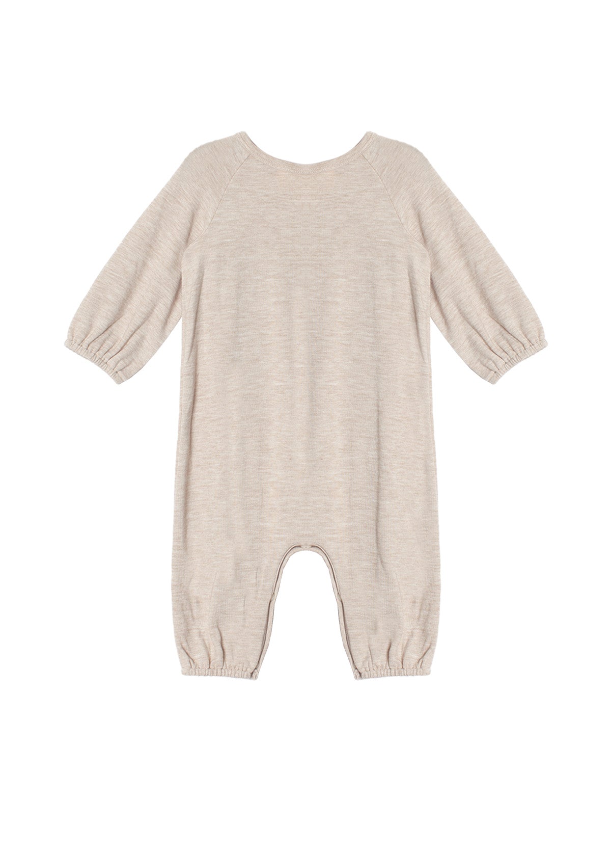 The Millie Romper by Mabel and Honey is a beige long-sleeve piece with an empire waist, elastic cuffs at the sleeves and ankles, smock detailing, and soft textured fabric, shown laid flat on a white background.