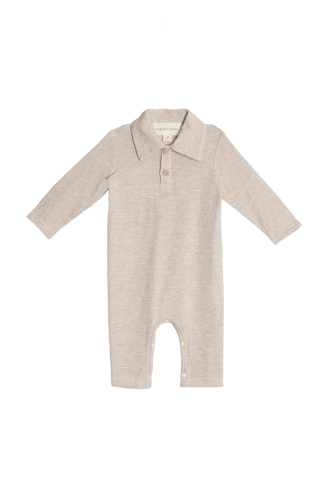 The Millie Brothers Romper by Beckett and Bear is a beige, long-sleeved romper with a collared neckline, front buttons, and inseam snaps for easy diaper changes, shown on a white background.