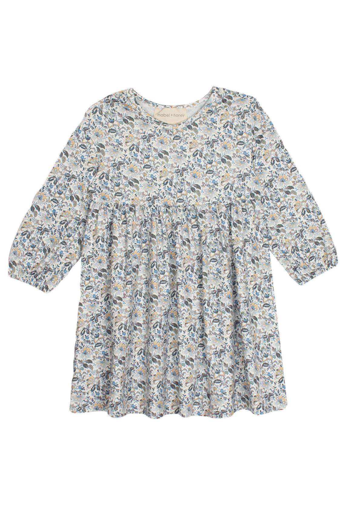 The Hazelnut Dress by Mabel and Honey is a girls long sleeve dress with a round neckline, gathered waist, and all-over blue, gray, and beige floral print on a light background—ideal for casual special occasions.