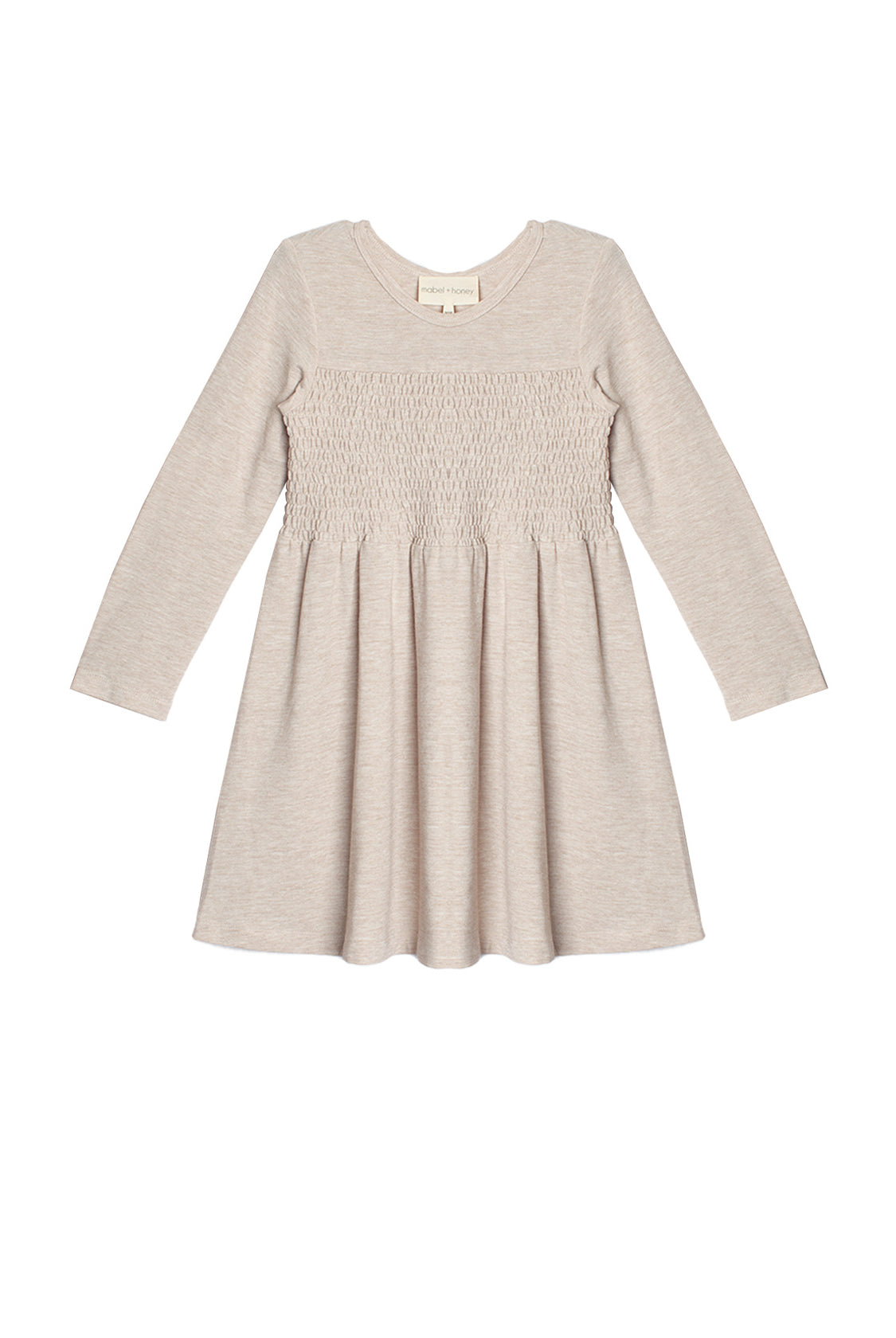 The Millie Natural Waist Dress by Mabel and Honey is a light beige, long-sleeved girl's dress with a smocked bodice and flared skirt, shown laid flat on a white background.