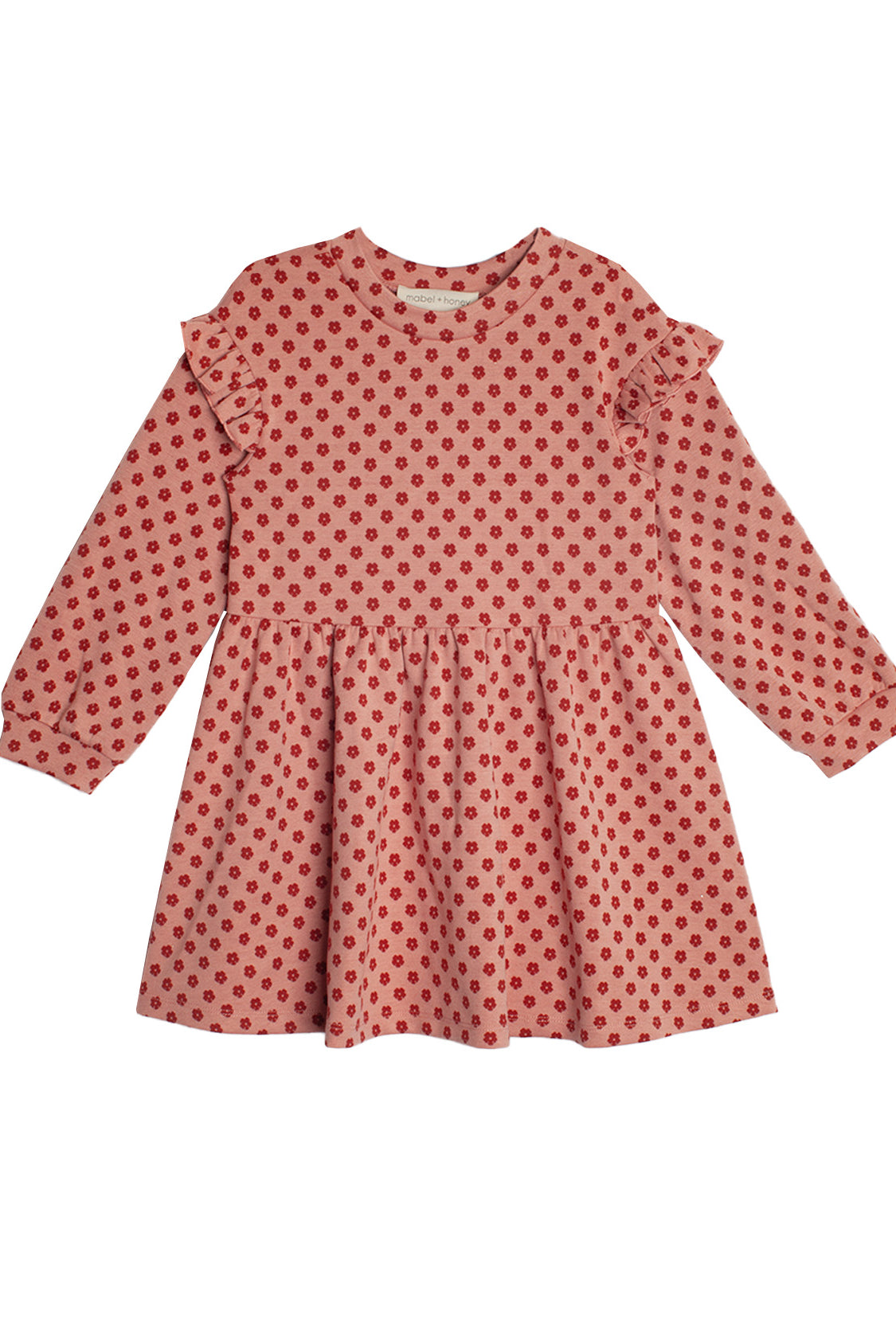 The Red Velvet Dress by Mabel and Honey features long sleeves, ruffled shoulders, a gathered skirt, and playful red polka dots for a charming, feminine look.
