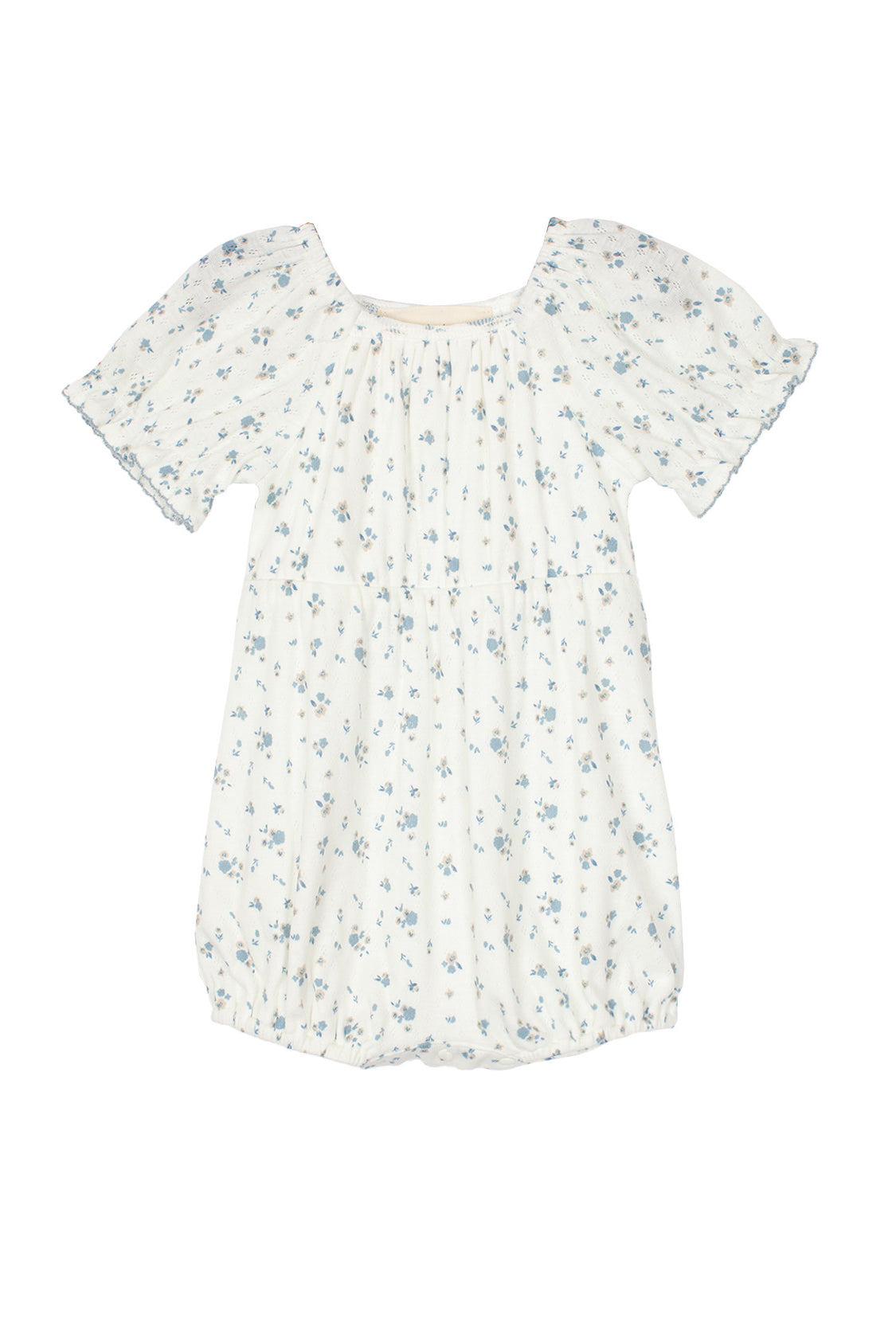 The Bluebell Baby Romper by Mabel and Honey features a white design with blue floral print, gathered neckline, puff sleeves, and a gently ruffled hem for a soft, delicate look.