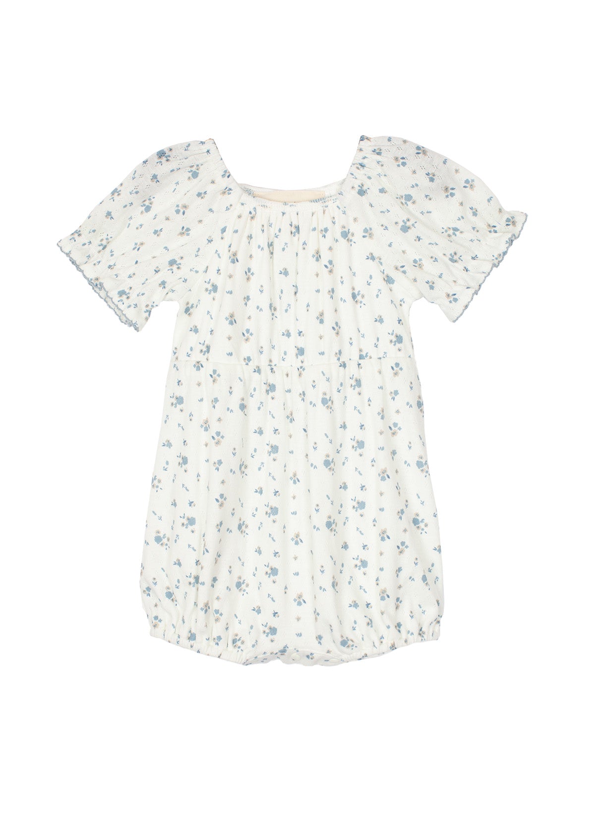 The Bluebell Baby Romper by Mabel and Honey features a white design with blue floral print, gathered neckline, puff sleeves, and a gently ruffled hem for a soft, delicate look.