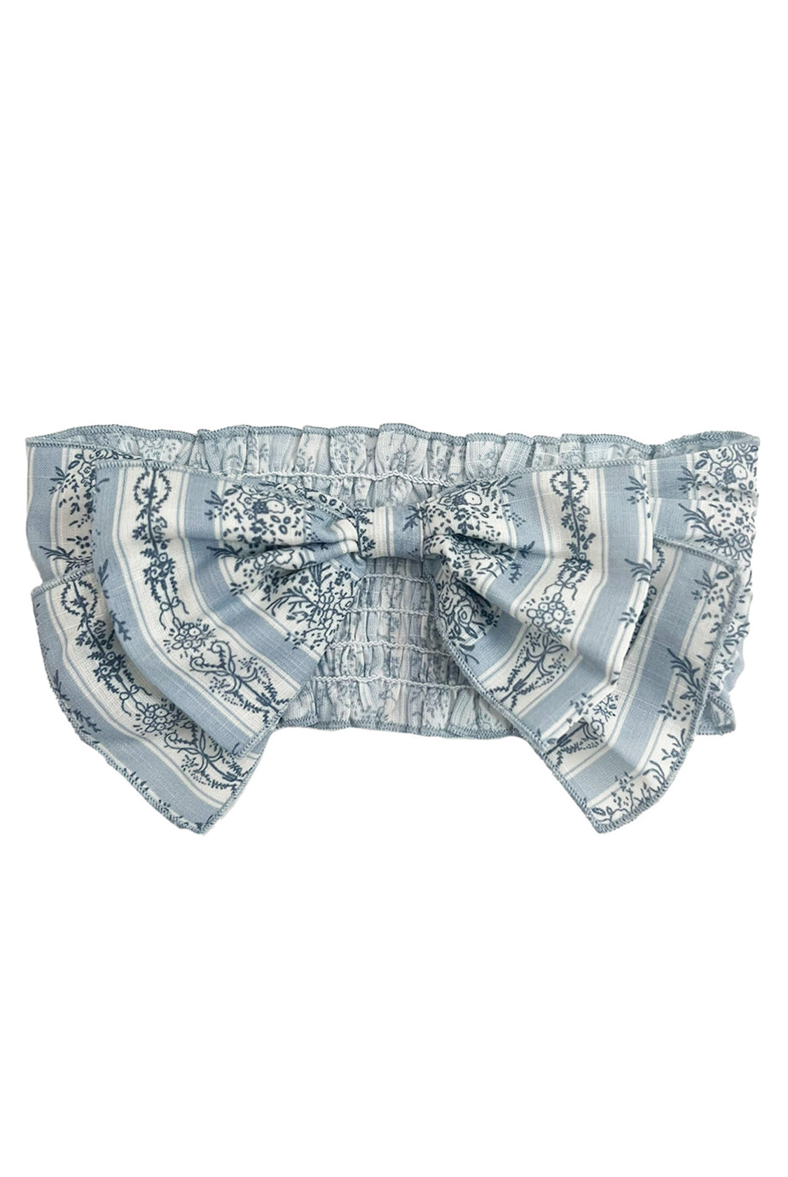 The Georgina Hair Accessory by Mabel and Honey is a light blue and white ruffled headband with a large decorative bow, featuring floral and striped patterns—an adorable choice for baby girls.