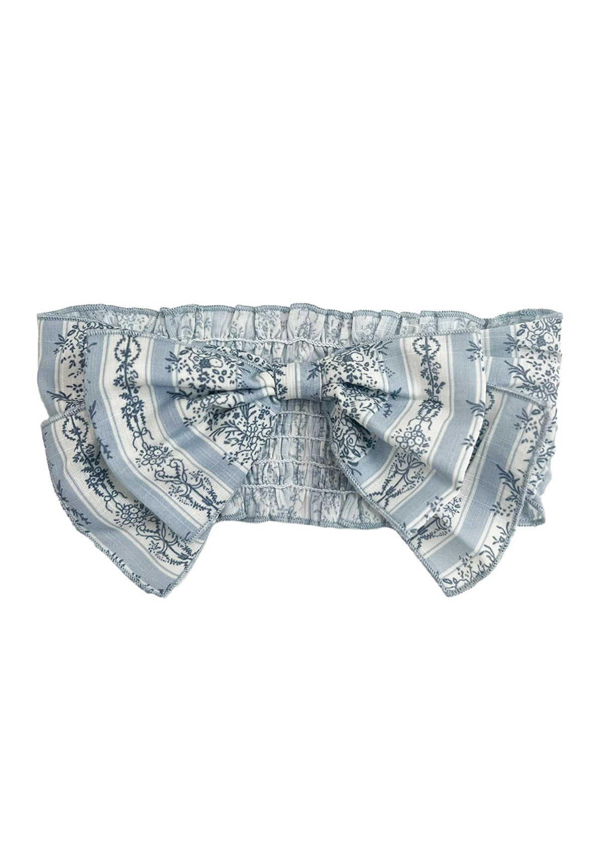 The Georgina Hair Accessory by Mabel and Honey is a light blue and white ruffled headband with a large decorative bow, featuring floral and striped patterns—an adorable choice for baby girls.