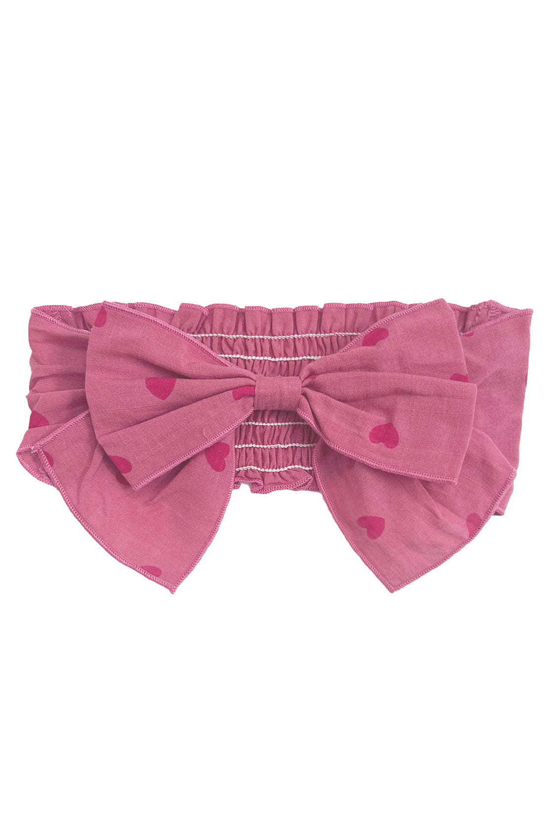 The Perfect in Pink Hair Clip Accessory by Mabel and Honey features an elastic, ruched band and a statement bow with a charming red heart pattern.