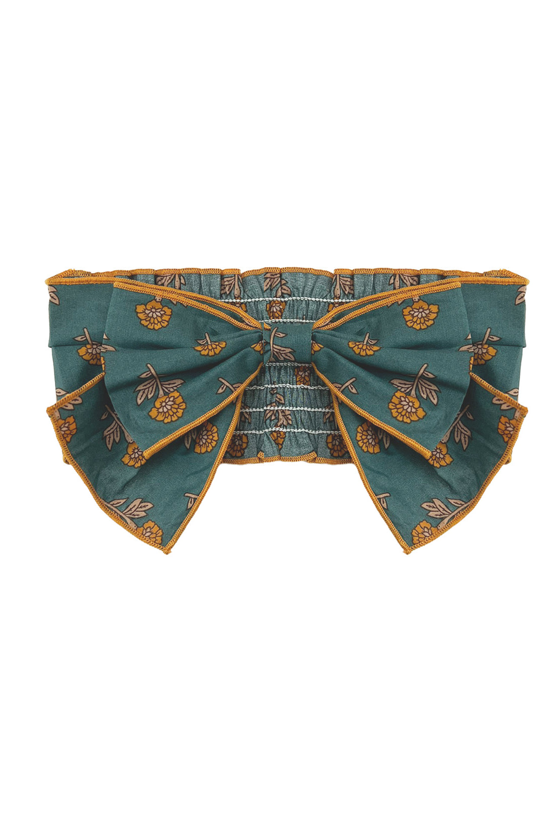 A teal belt with yellow floral patterns, an oversized center bow, and gold-trimmed edges pairs perfectly with the Mabel and Honey Autumn Ivy Hair Accessory.