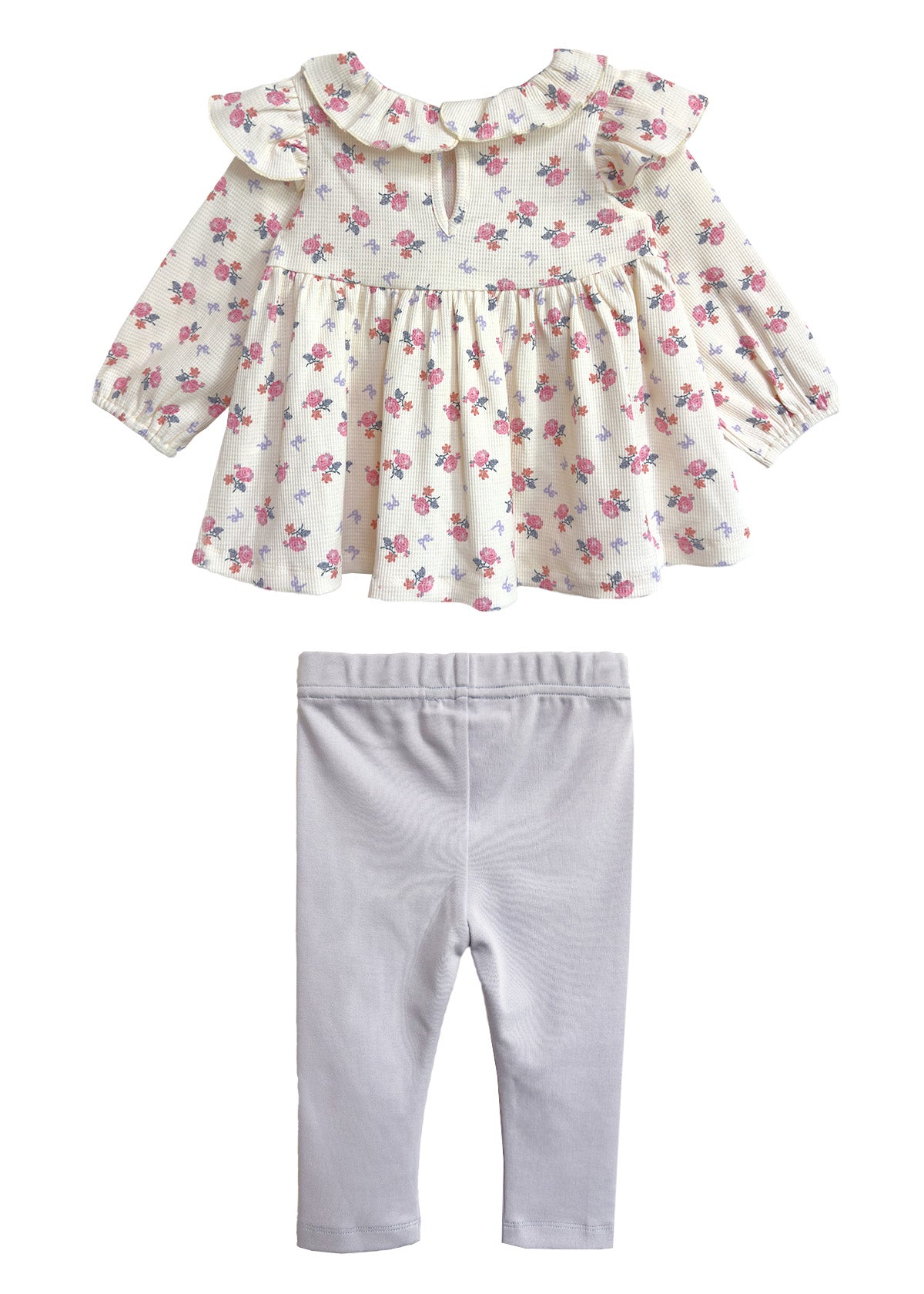 The Mia Two Piece Set by Mabel and Honey includes a cream floral ruffle blouse with a keyhole neck and light gray leggings—an adorable girls' outfit perfect for any occasion.