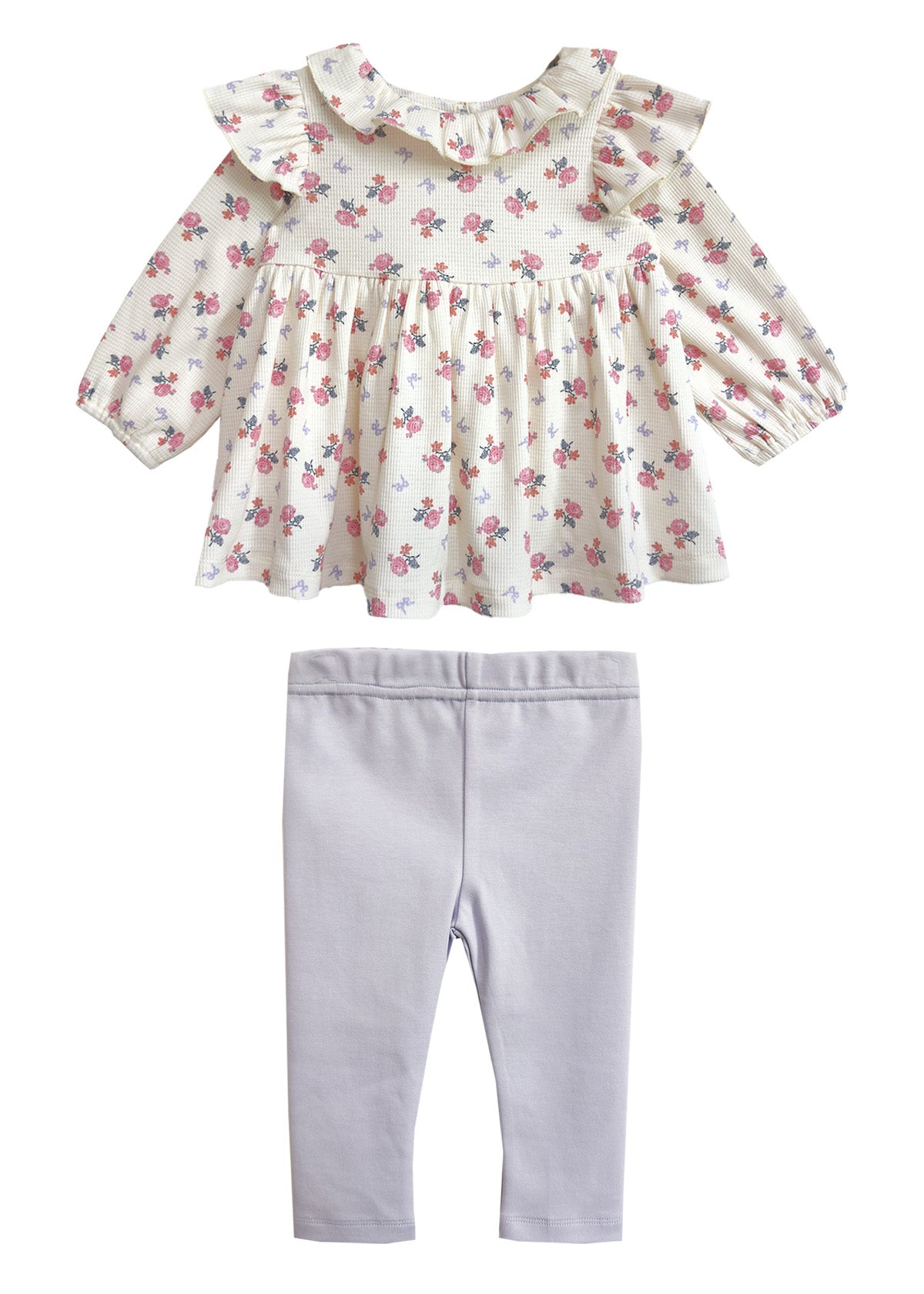 The Mia Two Piece Set by Mabel and Honey includes a floral blouse with a ruffled collar and long sleeves, paired with light purple leggings—an adorable outfit for girls.