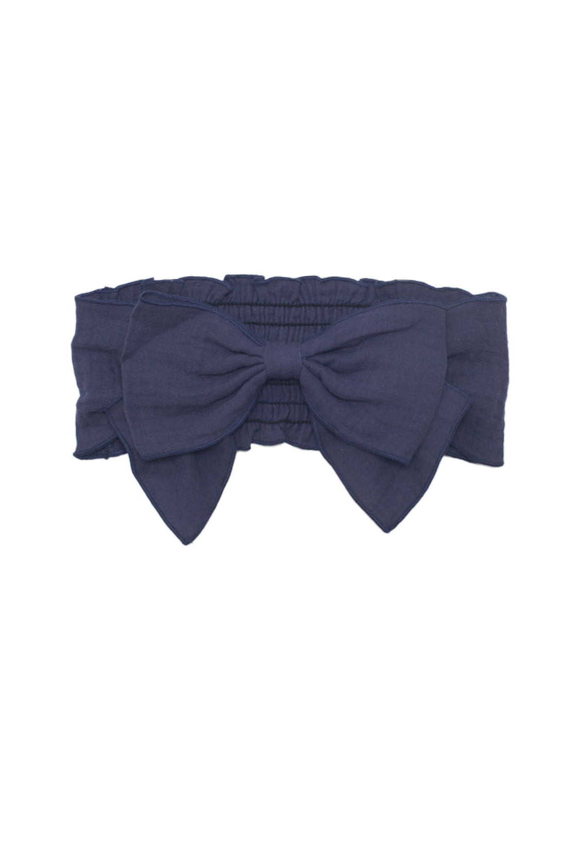 The Clara Hair Accessory by Mabel and Honey is a dark blue headband with an oversized center bow and an elastic back for a secure fit.