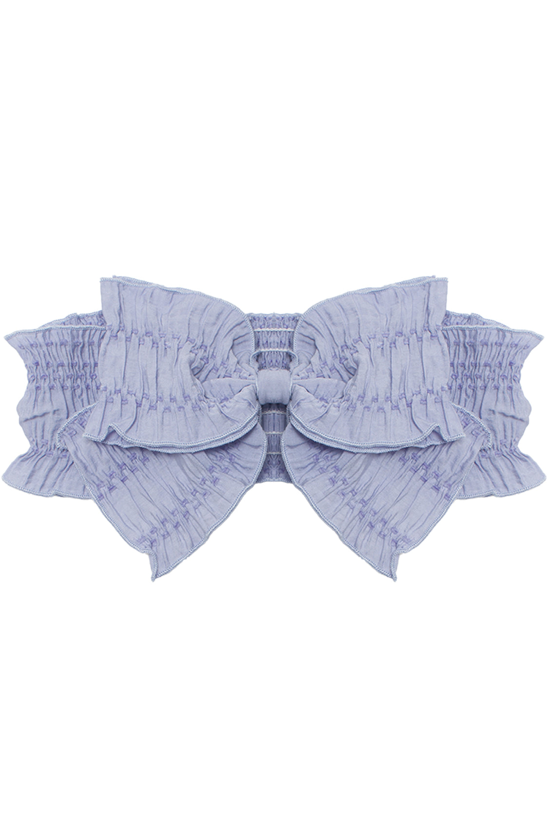 The Lena Hair Accessory by Mabel and Honey features a light lavender hue, a large ruched bow at the center, and a textured elastic band for stylish comfort.