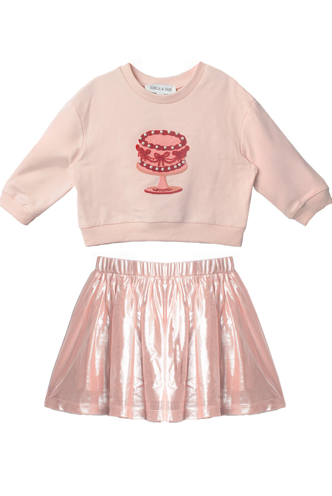 The Isobella and Chloe Sweet Cakes Two Piece Set features a light pink embroidered cake long-sleeve top and a shiny metallic pink skirt—perfect for sweet style in any girl’s wardrobe.