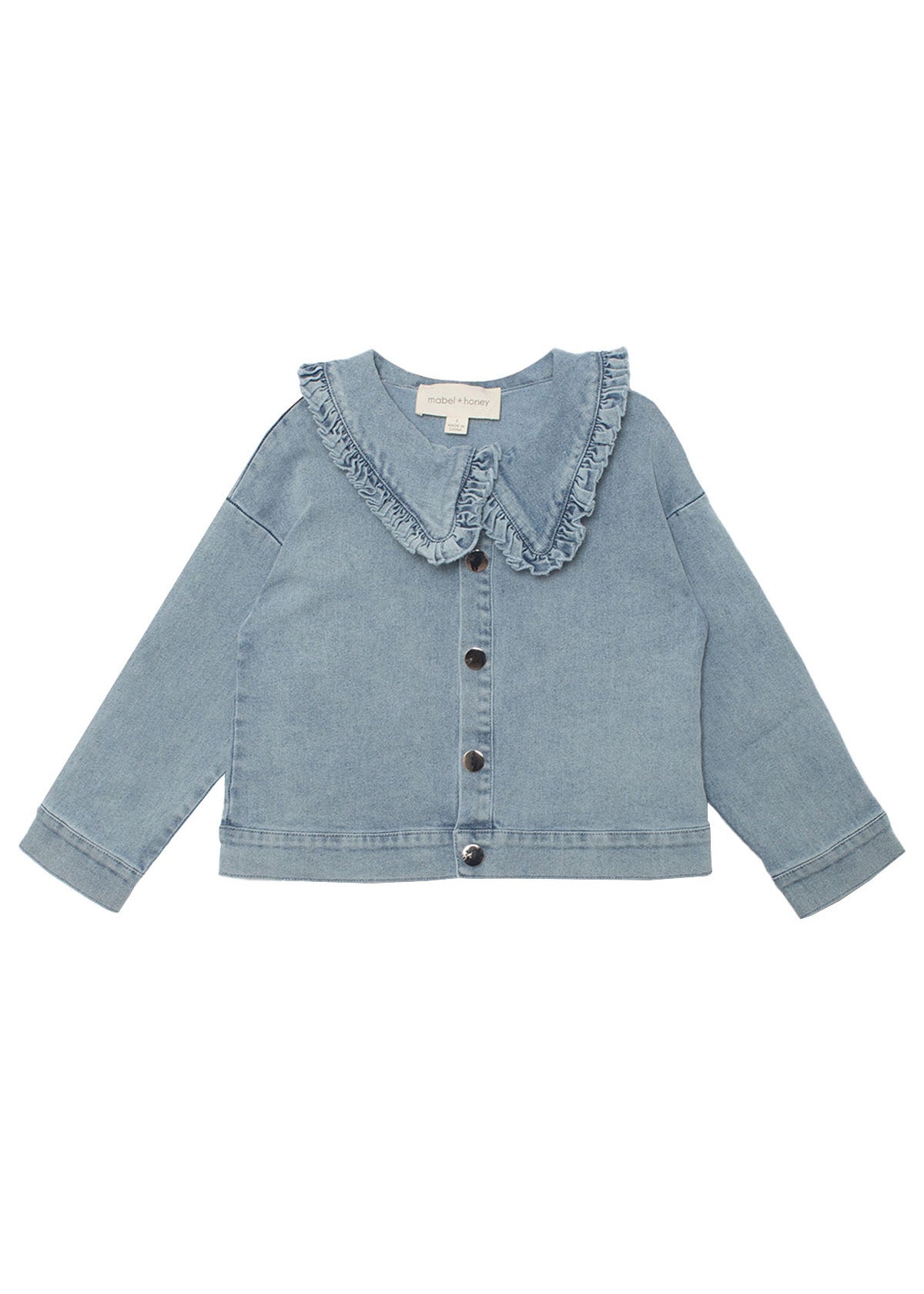 The Denim Days Ruffled Collar Jacket by Mabel and Honey features light blue denim, a wide ruffled collar, long sleeves, front buttons, and simple cuffs—perfect for a casual, slightly loose kids’ fit.