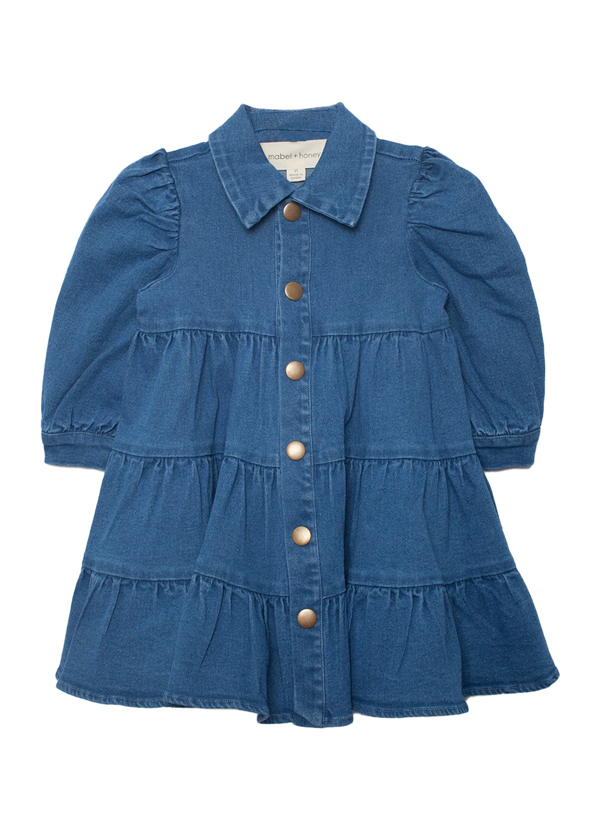 The Mabel and Honey Denim Days Tiered Dress is a stylish blue denim girls' dress with buttons, perfect for any occasion.