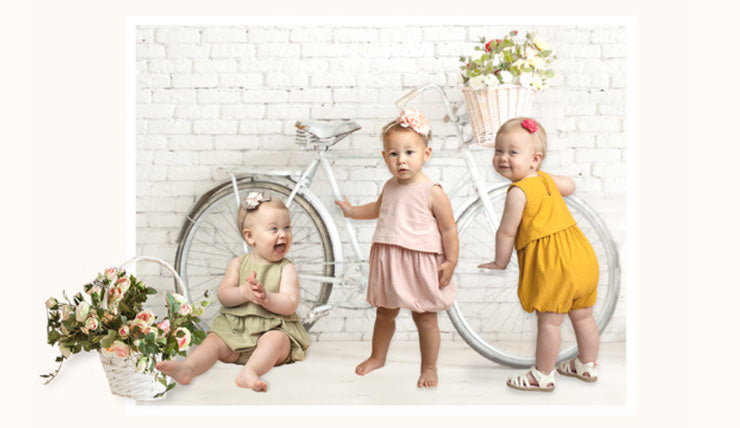 Three Babies wearing Jumpers