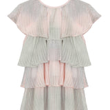 The Mabel + Honey Blush Belle Woven and Knit Dress features cap sleeves and a tiered ruffle design, crafted from sheer blush pink and gray striped fabric with subtle shimmering stripes for a loose, flowy silhouette.
