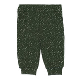 The Milo Knit Bottom Relaxed Jogger Pant in Forest Green Speckle Print by Mabel + Honey is shown laid flat on a white background. These girls’ joggers feature a dark forest green color with white speckles, an elastic waistband, side pockets, and cuffed ankles. Perfect for everyday wear, these relaxed knit jogger pants combine comfort and style.