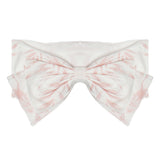 The Island Breeze Headband by Mabel and Honey features a light pink and white cotton bandeau with a large front bow and subtle geometric pattern—perfect for matching with your little one’s favorite outfits.