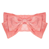 The Strawberry Cloud Headband by Mabel and Honey features a large pink fabric bow with layered wide loops and pointed ends, perfect as a baby hair accessory and part of the Simply Dandy collection, shown on a white background.