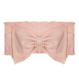 The Pink Petals Headband by Mabel and Honey is a light pink, ribbed 100% cotton baby hair accessory with a large matching center bow for added comfort and style.