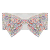 The Addison Headband by Mabel and Honey is a strapless cotton bandeau top with a central bow and colorful floral print—beautifully complemented when paired with your favorite hair accessory.