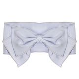 The Amelia Headband by Mabel and Honey is a wide, light blue fabric accessory with a large, layered-edge bow—ideal for babies. Shown from the front on a white background.