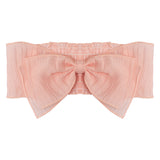 The Mabel and Honey Butterfly Kisses Pink Headband is a pale pink cotton bandeau-style top with a large central bow and ruffled elastic edges—ideal for pairing with your favorite cute baby accessory.