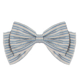 The Breezy Blue Skies Headband by Mabel and Honey features a neatly tied cotton bow with blue and white stripes, creating a charming baby hair accessory that stands out against a plain white background.