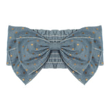 The Skylar Headband by Mabel and Honey is a large blue denim baby accessory with gold and silver embroidered stars on 100% cotton, featuring wide structured loops and a central knot for an elegant touch.