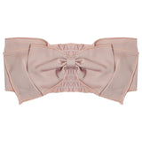 The Pretty in Pink Headband by Mabel and Honey features a wide blush pink band, a large central bow with ruched detailing, soft edges, and is crafted from 100% cotton for delicate comfort.