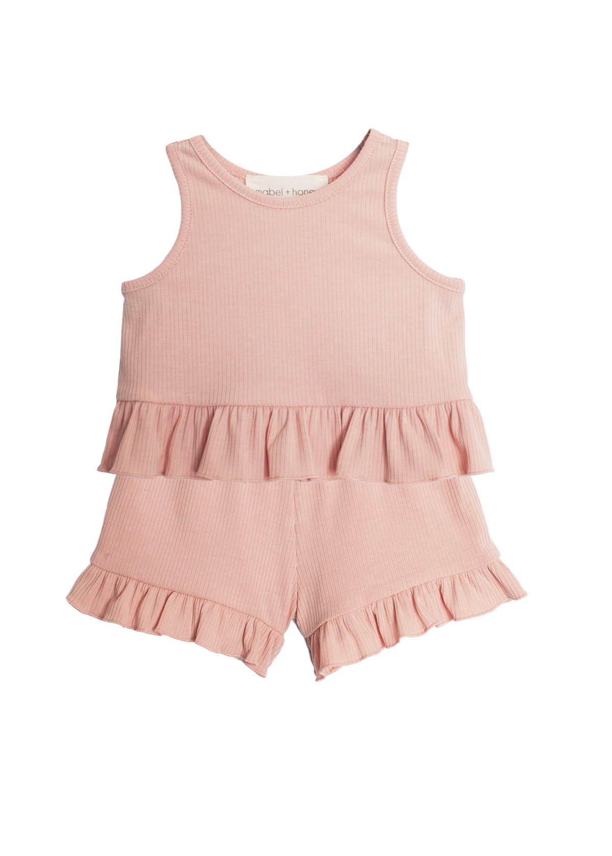 The Mabel and Honey Pink Petals Two Piece Short Set features a light pink, sleeveless style with ruffled waist and hem, crafted from ribbed fabric—an adorable summer outfit for toddlers.
