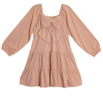 The Flower Mae Pink Dress by Mabel and Honey is a light pink, long sleeve, knee-length dress with a square neckline, ruffled tiers, and a bow detail on the bodice for a charming, feminine touch.