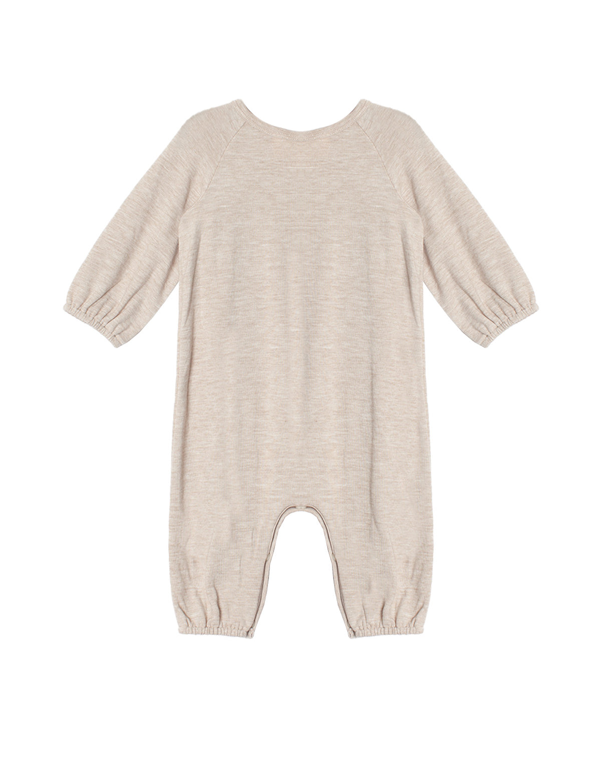 The Millie Romper by Mabel and Honey is a beige long-sleeve piece with an empire waist, elastic cuffs at the sleeves and ankles, smock detailing, and soft textured fabric, shown laid flat on a white background.