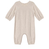 The Millie Romper by Mabel and Honey is a beige long-sleeve piece with an empire waist, elastic cuffs at the sleeves and ankles, smock detailing, and soft textured fabric, shown laid flat on a white background.