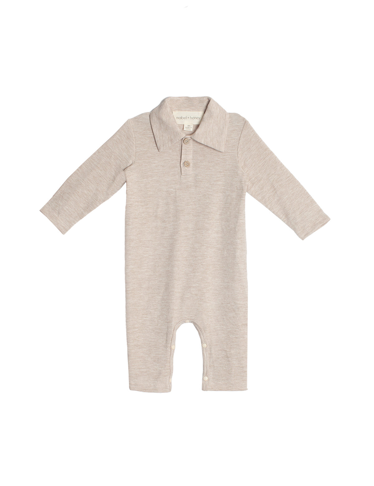 The Millie Brothers Romper by Beckett and Bear is a beige, long-sleeved romper with a collared neckline, front buttons, and inseam snaps for easy diaper changes, shown on a white background.