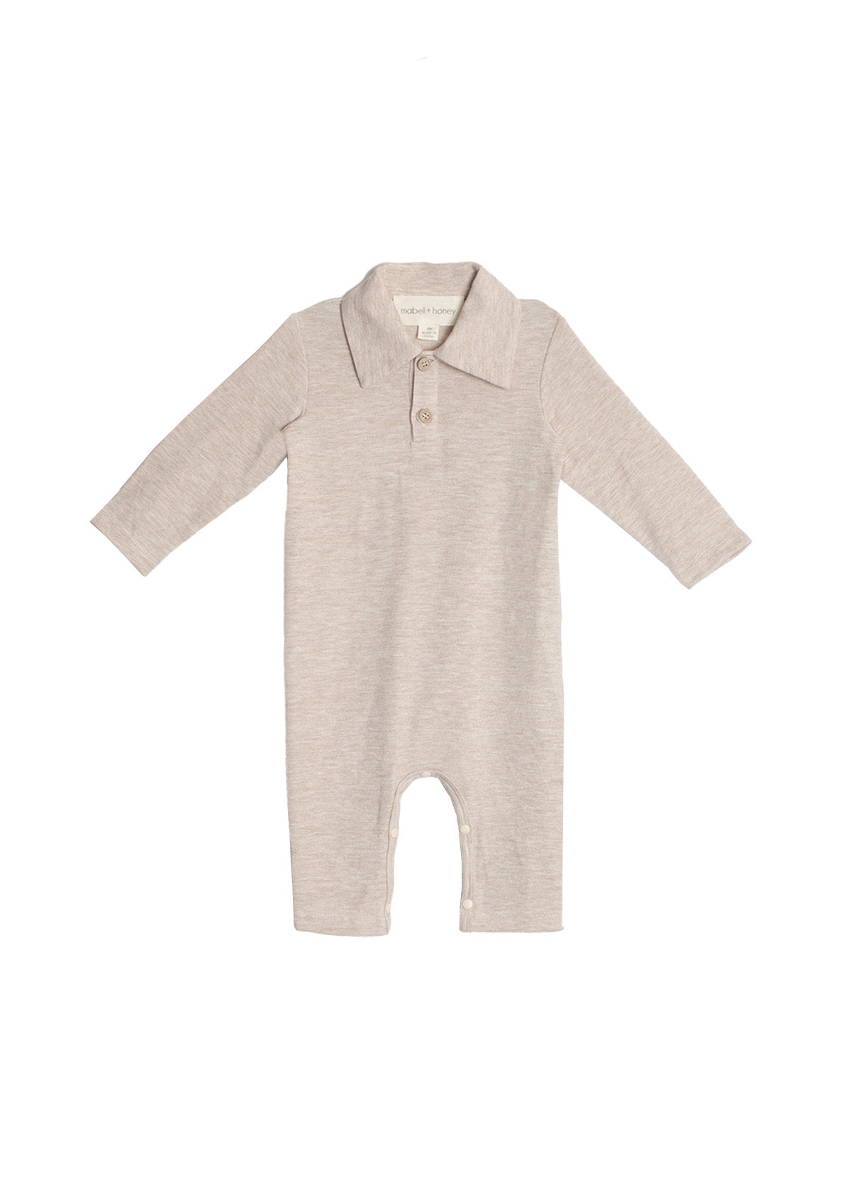 The Millie Brothers Romper by Beckett and Bear is a beige, long-sleeved romper with a collared neckline, front buttons, and inseam snaps for easy diaper changes, shown on a white background.