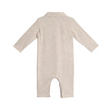 The Millie Brothers Romper by Beckett and Bear is a beige, long-sleeved romper with a collared neckline, shown from the back and laid flat on a white background.