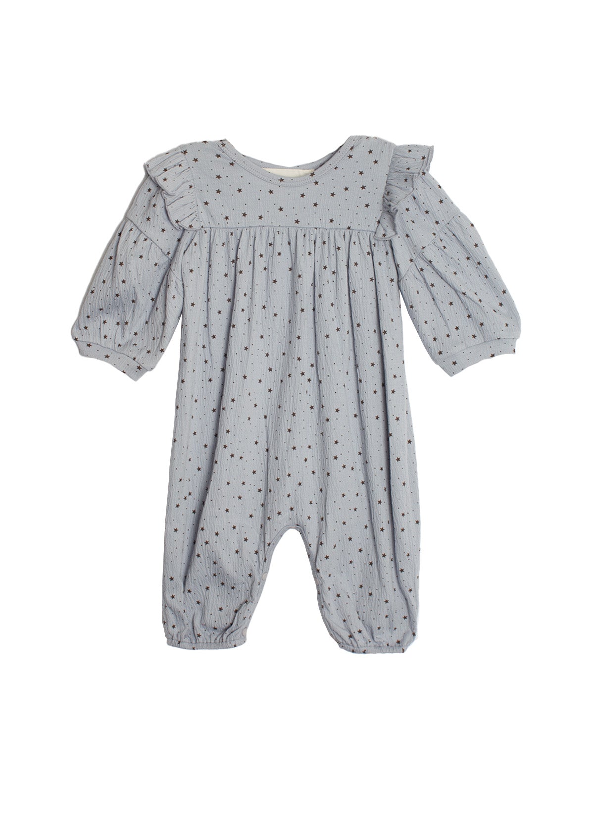 The Mabel and Honey Twinkle Twinkle Romper features light blue-gray fabric with small black polka dots, ruffle shoulders, gathered cuffs at wrists and ankles, and a loose, comfy fit for girls.
