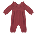 The Mabel and Honey Autumn Romper boasts long sleeves, maroon fabric, a ruffled collar, smocked front, elastic cuffs, and inseam snaps—making it perfect for cozy autumn style.