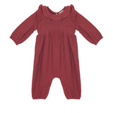 The Mabel and Honey Autumn Romper boasts long sleeves, maroon fabric, a ruffled collar, smocked front, elastic cuffs, and inseam snaps—making it perfect for cozy autumn style.