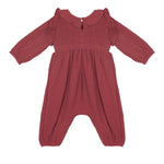 The Mabel and Honey Autumn Romper features a dusty rose color, ruffled collar, smocked front, and loose-fitting legs in soft, lightweight fabric—perfect for keeping infants or toddlers comfortable.