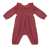 The Mabel and Honey Autumn Romper features a dusty rose color, ruffled collar, smocked front, and loose-fitting legs in soft, lightweight fabric—perfect for keeping infants or toddlers comfortable.