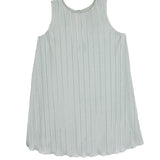 The Isobella and Chloe Wintermelon Dress is a sleeveless, light gray girls’ dress with a round neckline, relaxed fit, and elegant vertical pleats, shown laid flat on a white background.