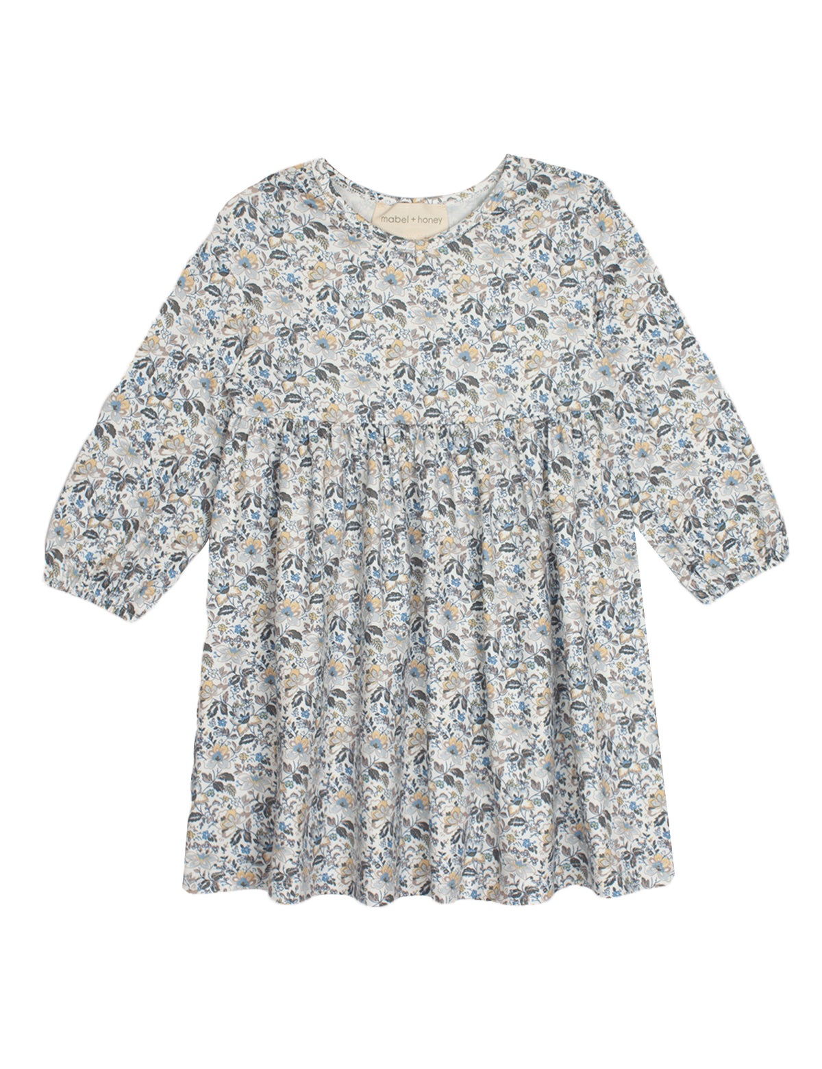 The Hazelnut Dress by Mabel and Honey is a girls long sleeve dress with a round neckline, gathered waist, and all-over blue, gray, and beige floral print on a light background—ideal for casual special occasions.