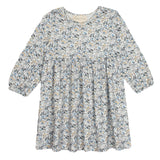 The Hazelnut Dress by Mabel and Honey is a girls long sleeve dress with a round neckline, gathered waist, and all-over blue, gray, and beige floral print on a light background—ideal for casual special occasions.