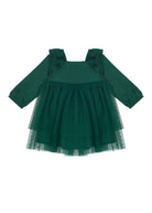 The Isobella and Chloe Mistletoe Emerald Dress features long sleeves, ruffled shoulders, a square neckline, elastic cuffs, and a layered tulle skirt with small polka dots—ideal for holiday celebrations.