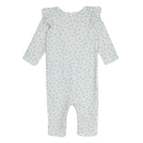 The Hannah Romper by Mabel and Honey is a light blue cotton baby romper with a small floral print and ruffled shoulders, shown on a white background—ideal for both comfort and style.