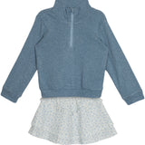 The Hannah Two Piece Set by Mabel and Honey features a blue long-sleeve half-zip pullover and a white light blue floral ruffled skirt, displayed flat on a white background.