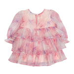 The Isobella and Chloe Berry Swirl Watercolor Print Dress is a pink and purple kids’ dress with long puffy sleeves, three ruffled tiers, a round neckline, and a back button closure.